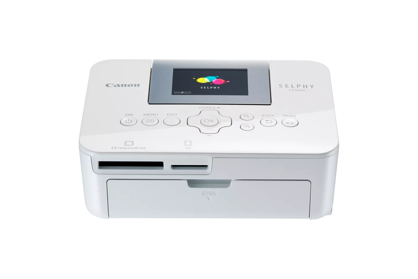 Canon SELPHY CP1000 portable photo printer. Compact design with LCD screen and card slots.